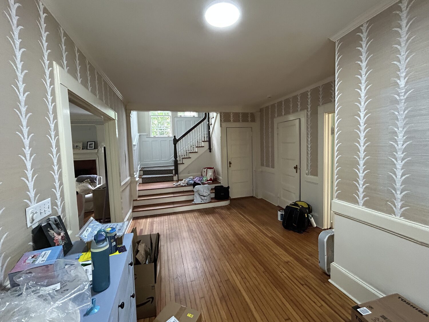 Foyer during work with botanical wallpaper