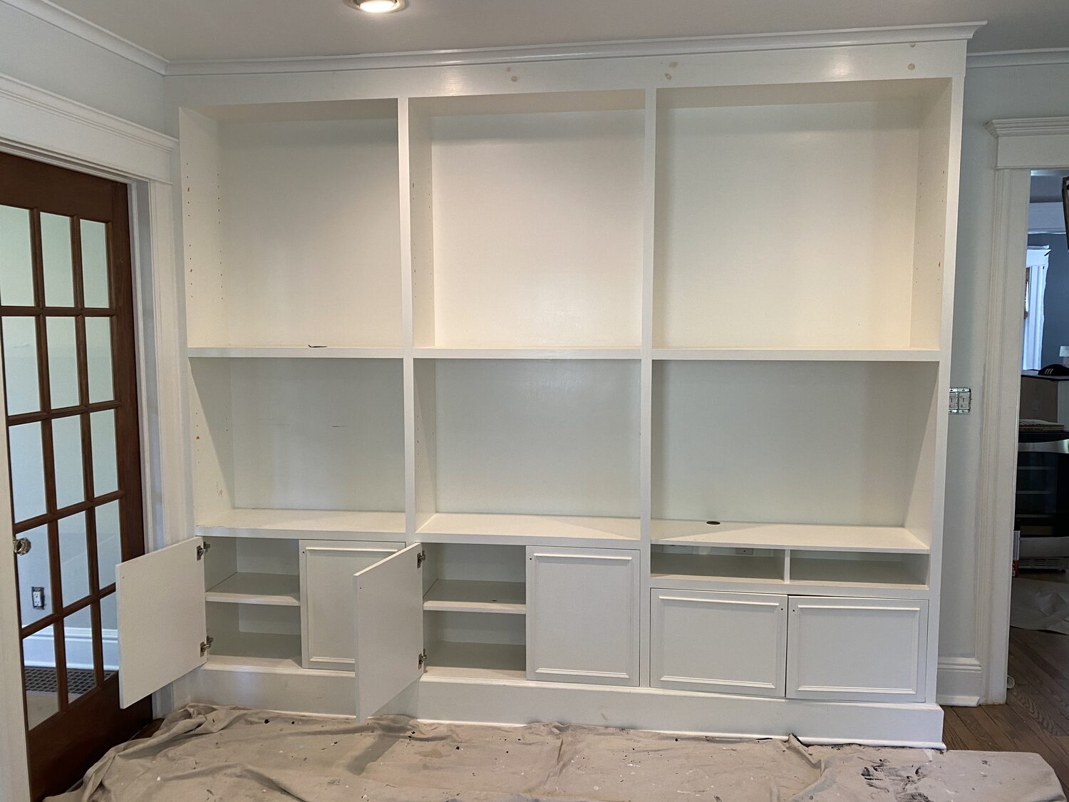 Built-in bookcase in white before refinishing