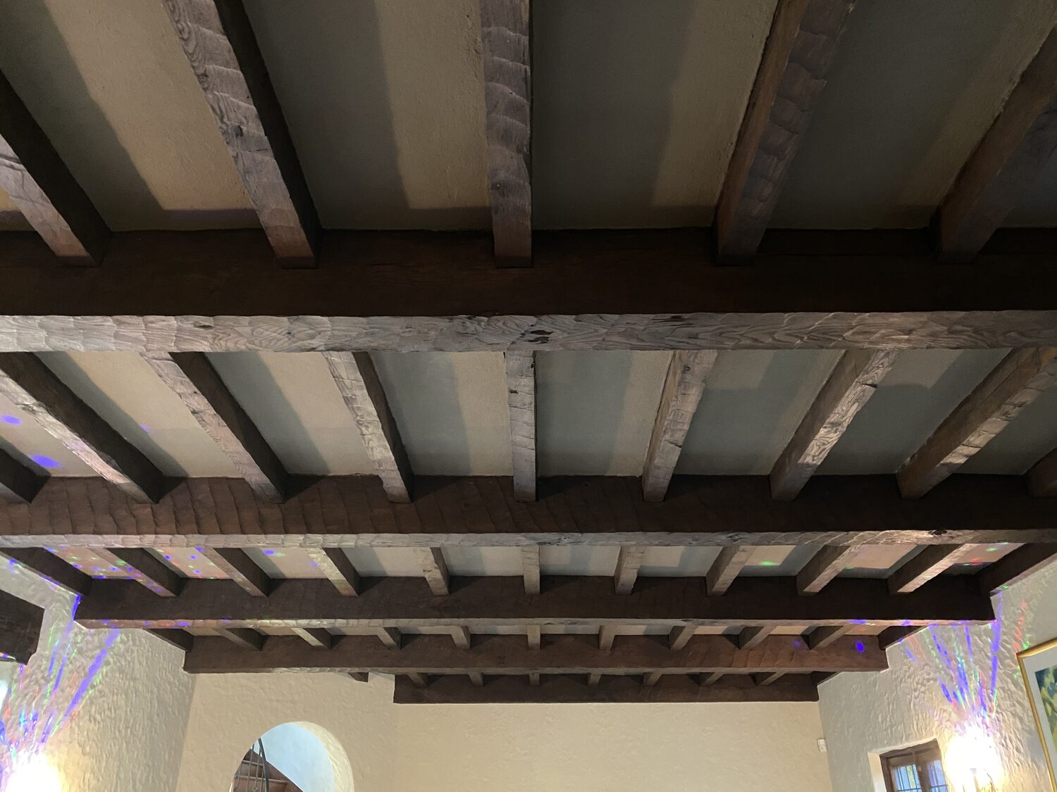 Weathered exposed beam ceiling before restoration