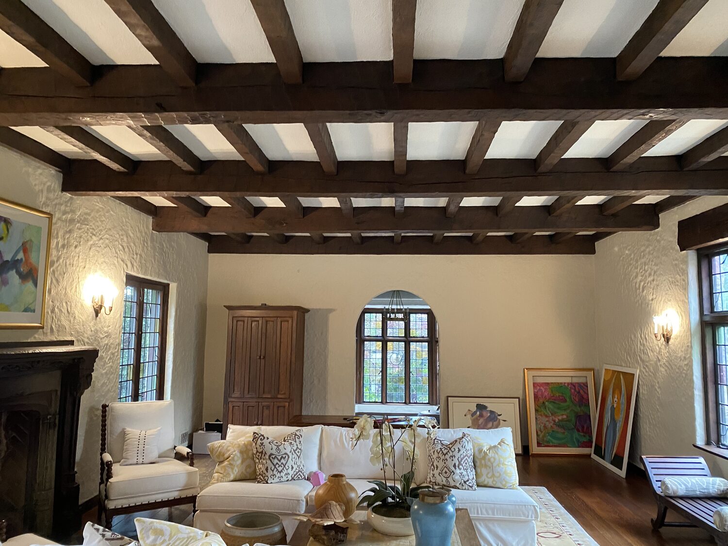 Finished living room with restored exposed beam ceiling